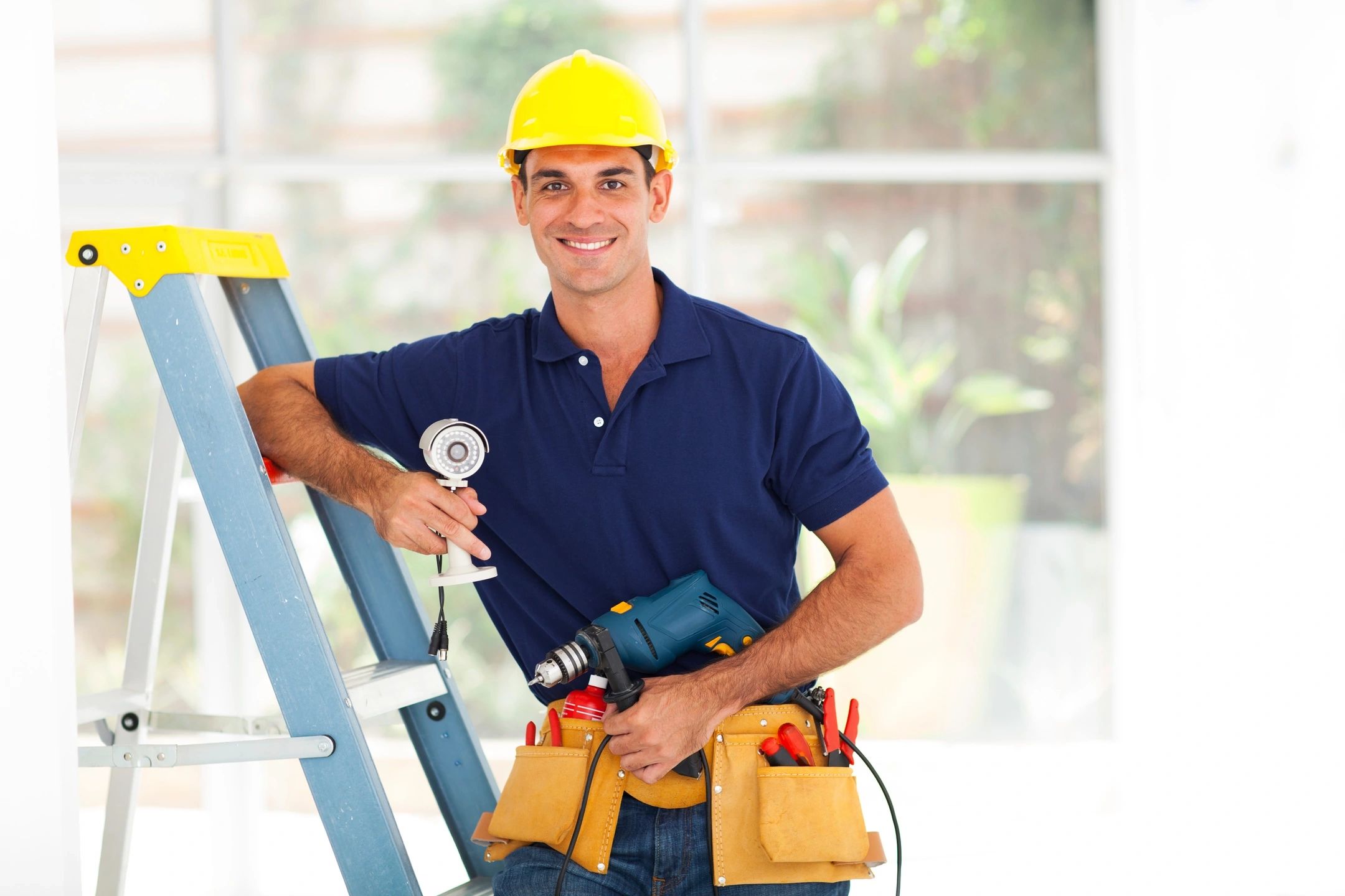 Construction worker leaning on ladder